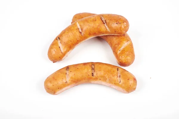 Grilled chicken sausages isolated on a white background — Stock Photo, Image