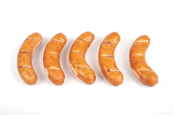 Grilled sausages isolated on a white background — Stock Photo, Image