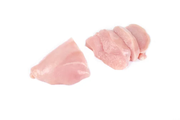 Uncooked chicken fillet and slices of chicken fillet isolated on white. — 图库照片