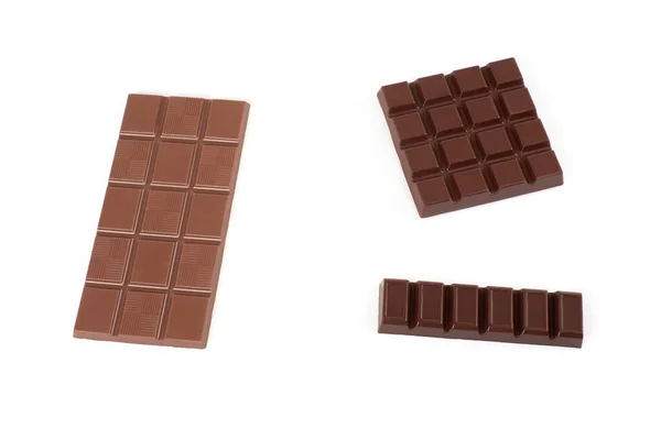Olika typer av choklad på vit bakgrund. — Stockfoto