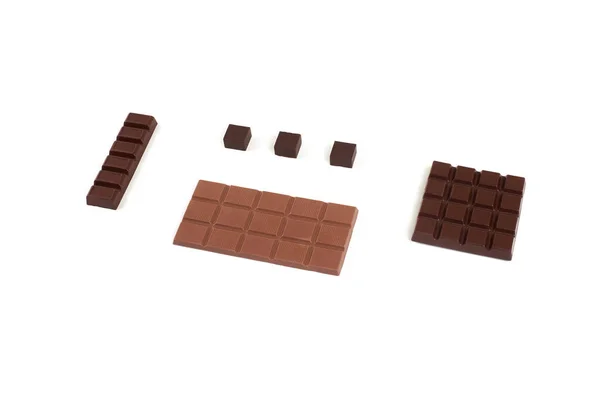 Diferentes tipos de chocolate no fundo branco . — Fotografia de Stock