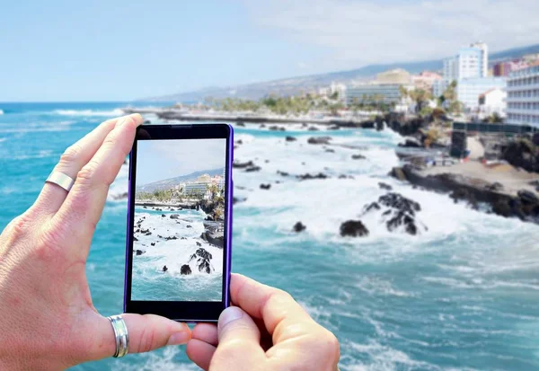 Taking a photo of the coast