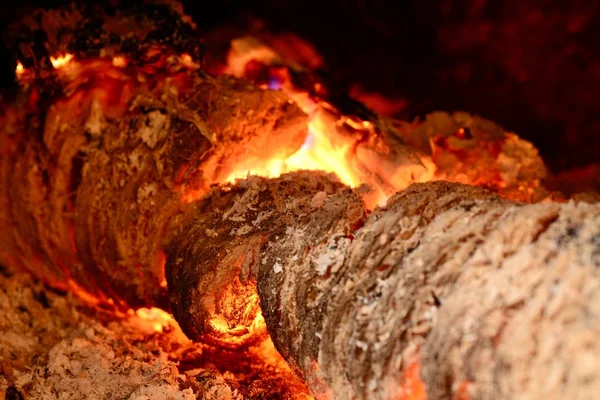 Blazing burning logs in the fireplace — Stock Photo, Image