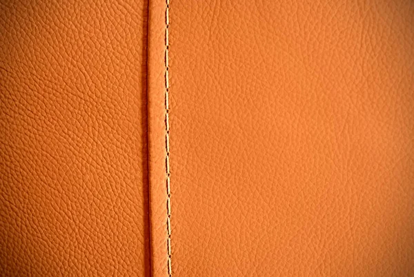Vollrahmen Hintergrundstruktur Aus Orangefarbenem Kieselleder Mit Einem Nahtfaden — Stockfoto