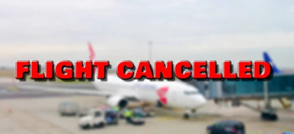 Plane at gate marked with cancelled sign waiting for passengers boarding. According to currently cancelled flights due to world pandemic of coronavirus.