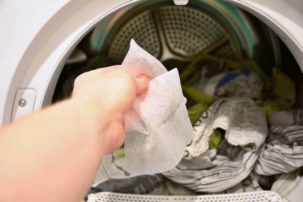 Hand Holding Put Dryer Sheet Tumble Clothes Dryer — Stock Photo, Image