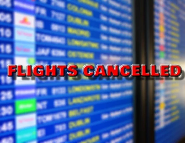 Departures Board Cancelled Flights Other Destinations Marked Cancelled Sign According — Stock Photo, Image