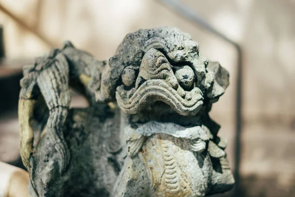 Lion statue in temple with sun light — Stock Photo, Image