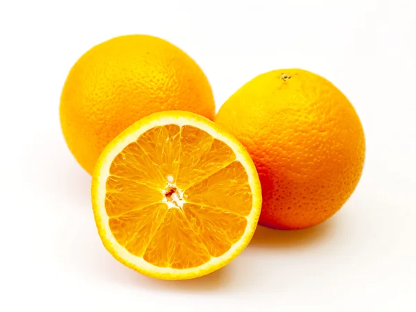 Bright juicy oranges on a table — Stock Photo, Image