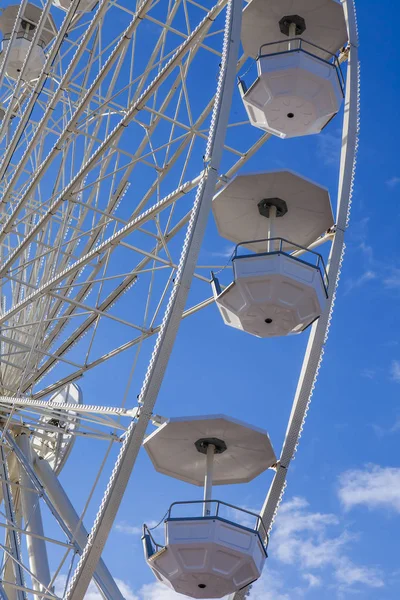 The sun lights a fragment of designs devil's wheels against the background of the bright blue sky — Stock Photo, Image