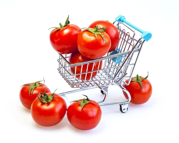 Fresh ripe tomatoes lie in the tiny store cart — Stock Photo, Image