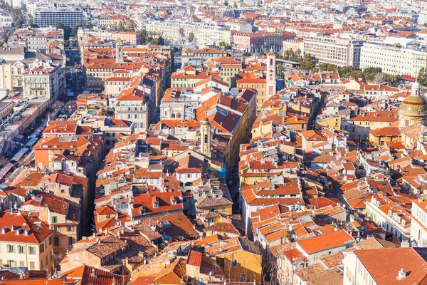 NICE, FRANCE, on JANUARY 9, 2017. The morning sun lights red roofs of the old city. Aerial view from Shatto's hill — Stock Photo, Image