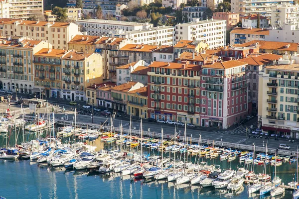 NICE, FRANCE, on JANUARY 9, 2017. The sun lights the numerous yachts moored in city port. Aerial view from Shatto's hill — Stock Photo, Image