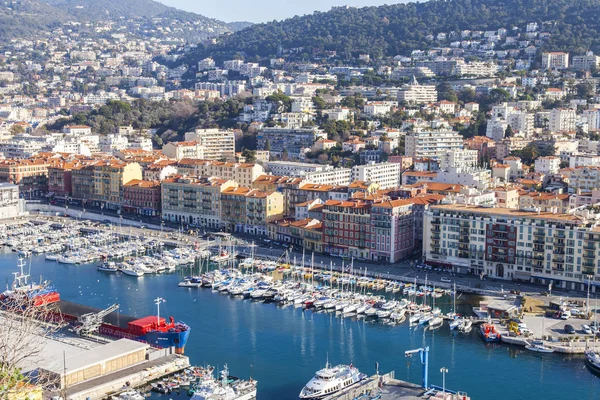 NICE, FRANCE, on JANUARY 9, 2017. The sun lights the numerous yachts moored in city port. Aerial view from Shatto's hill — Stock Photo, Image