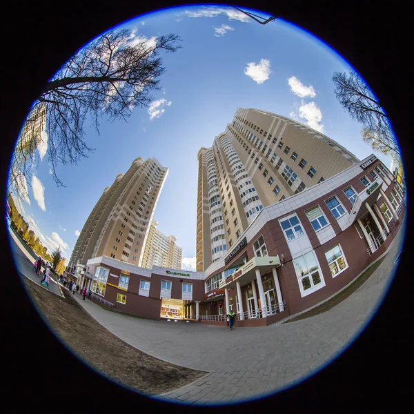 PUSHKINO, RUSSIA, on May 7, 2017. The bright spring sun lights new multystoried houses. Fish eye view. — Stock Photo, Image