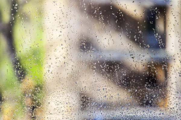 View through damp glass with rain drops — Stock Photo, Image