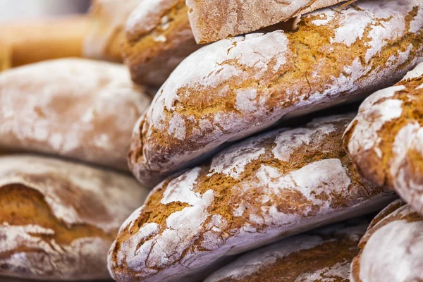 Tasty fresh bread on a counter in shop — Stock Photo, Image