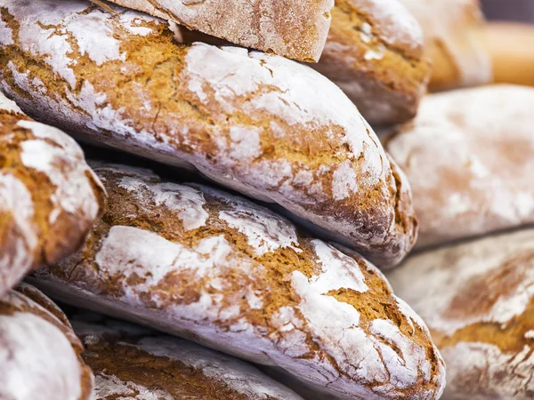 Tasty fresh bread on a counter in shop — Stock Photo, Image