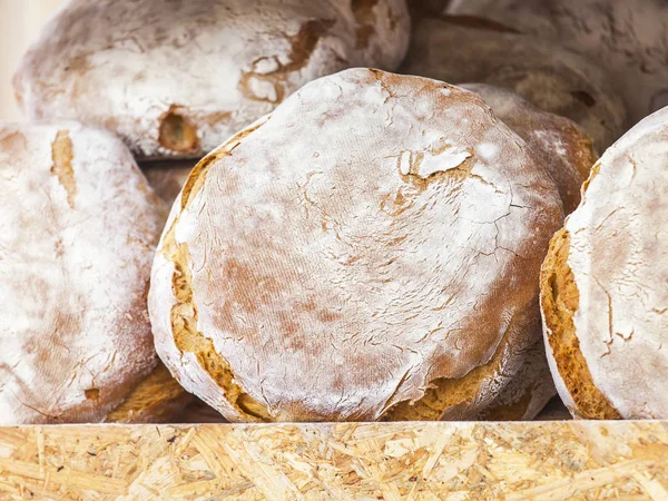 Tasty fresh bread on a counter in shop — Stock Photo, Image