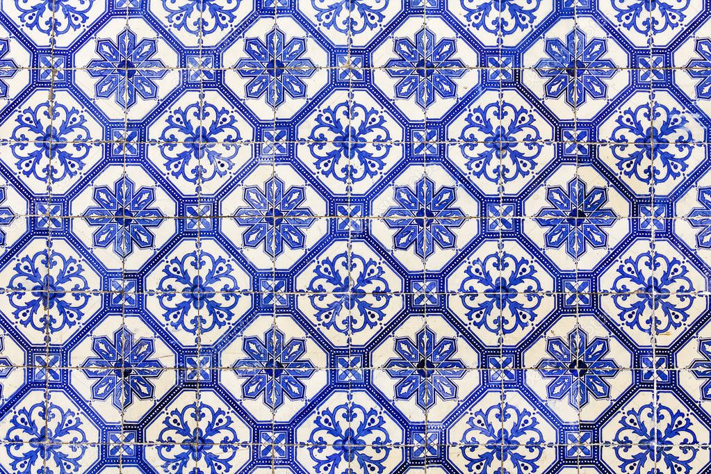  LISBON, PORTUGAL, on June 22, 2017. Traditional Portuguese ceramic tiles of azulejo decorate a facade of the ancient building 