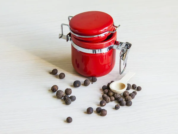Capacity for spices and black pepper on a table — Stock Photo, Image