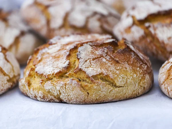 Tasty fresh bread on a counter in shop — Stock Photo, Image