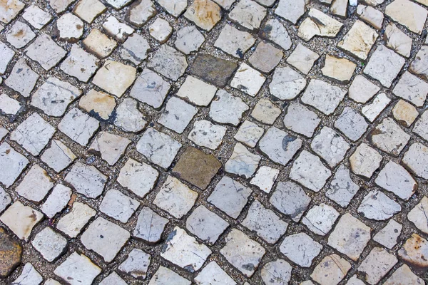 A estrada pavimentada com uma antiga telha de pedra — Fotografia de Stock