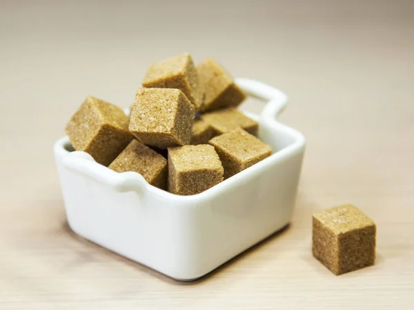 Brown cane sugar on a table — Stock Photo, Image