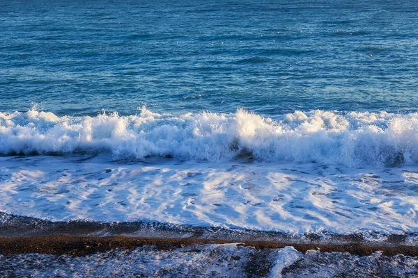 Picturesque surf at the coast of a bay in the Atlantic Ocean.