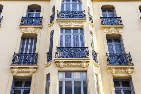 NICE, FRANCE, on March 6, 2018. The sun lights a facade of a beautiful house in the downtown