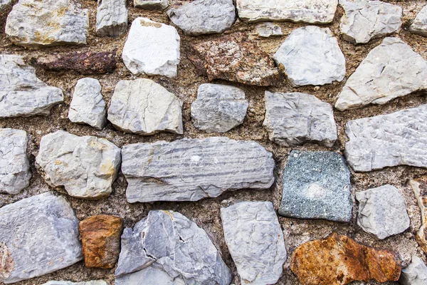 Surface of an old stone porous wall