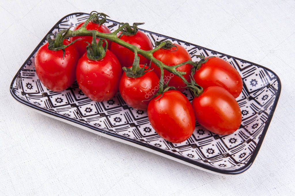 Fresh cherry tomatoes on a table