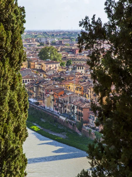 Verona, Italy, on April 24, 2019. Scenic  view to the slope of the hill on the  coast the river of Adige