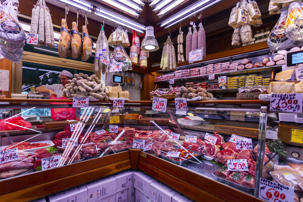 Milan, Italy, February 12, 2020. Showcase of a butcher shop with authentic local produce.