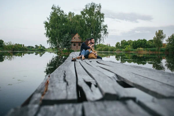 Romantic couple on wooden bridge — Stock Photo, Image