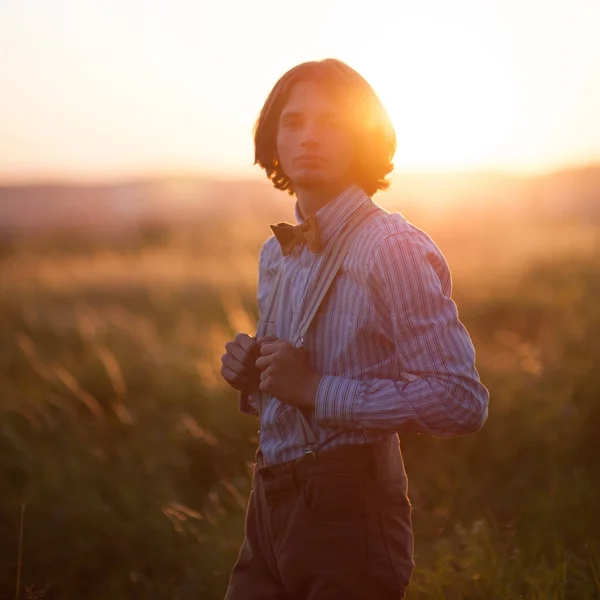 Young man posing in field — Stock Photo, Image