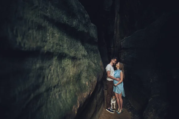 Lovely couple standing against rocks of fortress — Stock Photo, Image