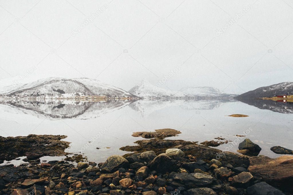 Scenic view of Hjorundfjorden on west coast of Norway with reflection in water