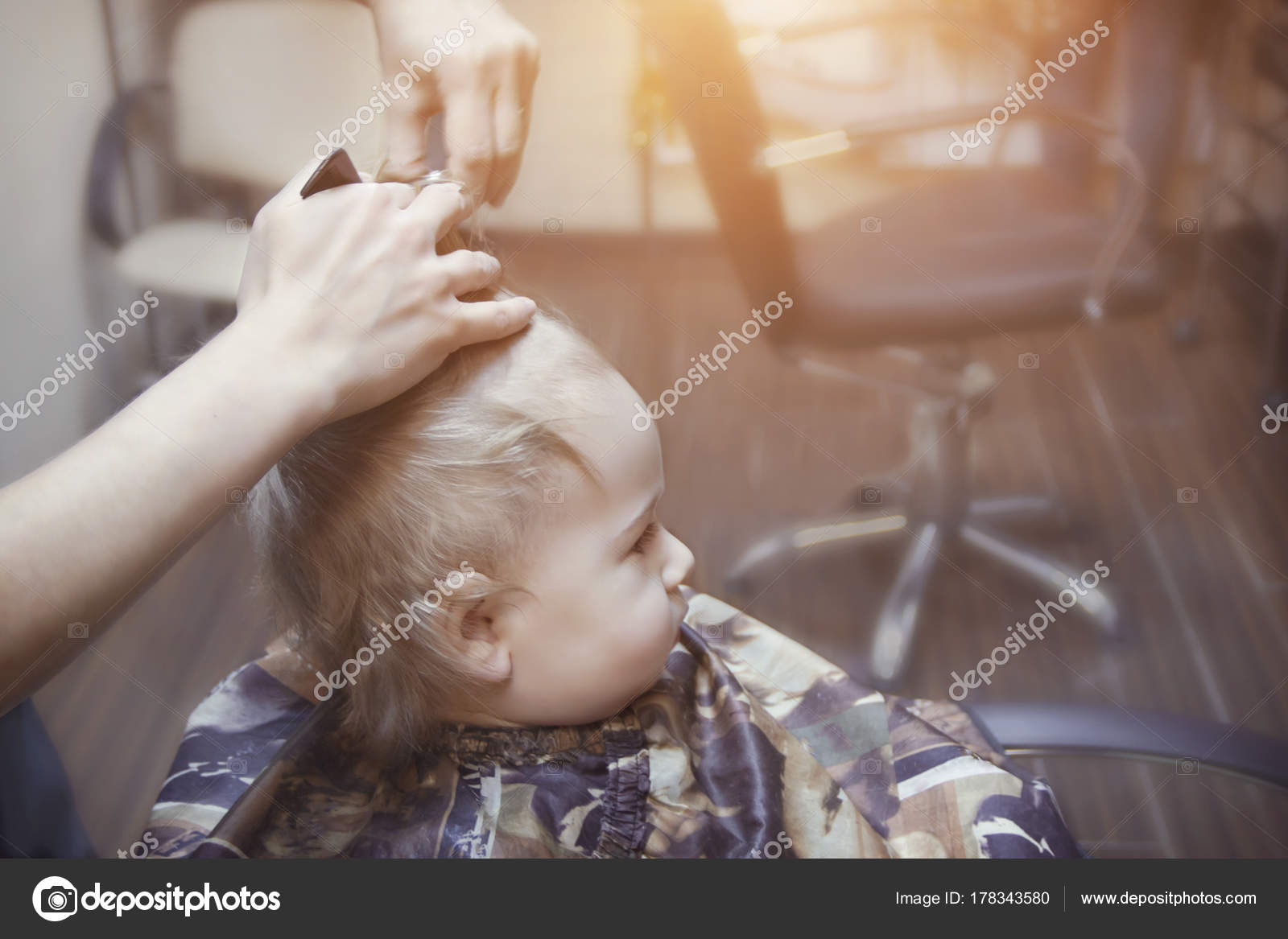 One Year Old Boy For The First Time Makes The Haircut In A Barber