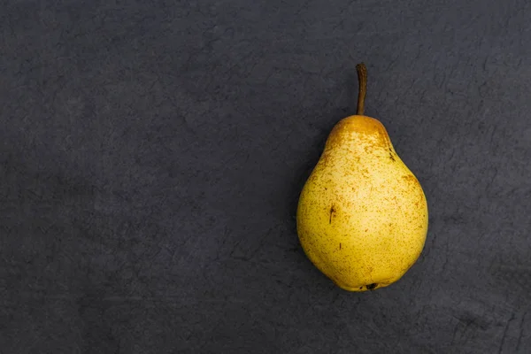 Pear fruit isolated on dark background — Stock Photo, Image