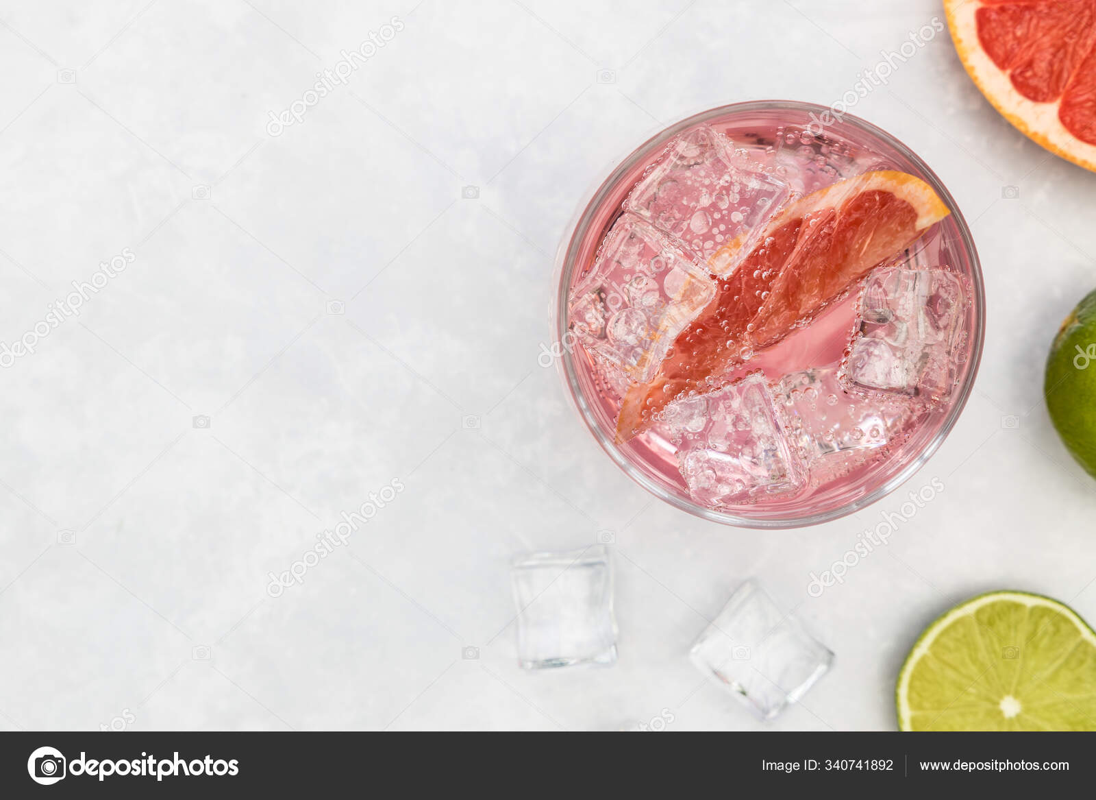 Pink gin tonic vodka soda fruit grapefruit cocktail drink in gla Stock