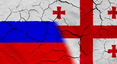 Kurumuş toprak doku ile Rusya ve Gürcistan bayrağı