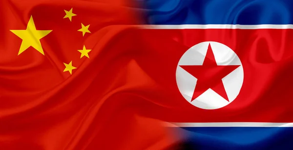 Cina e Corea del Nord bandiera con trama tessuto — Foto Stock