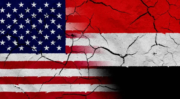 USA und Jemen Flagge mit getrockneten Boden Textur — Stockfoto