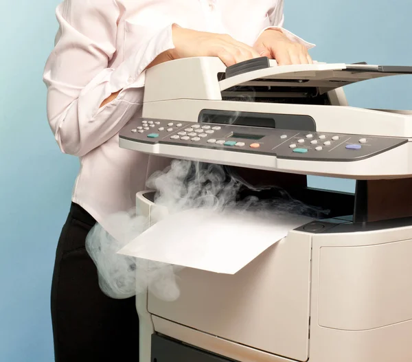 Woman with smoking copier — Stock Photo, Image