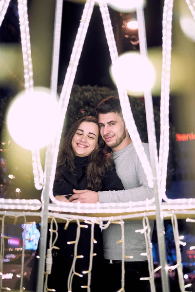 Young couple enjoying Christmas Lights — 스톡 사진