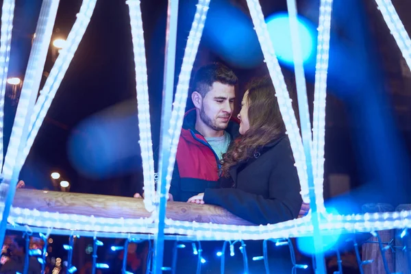 Young couple enjoying Christmas Lights — 스톡 사진