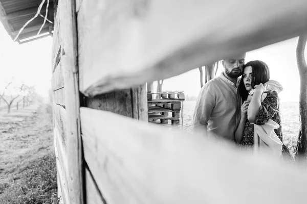 Young couple near in old wooden house