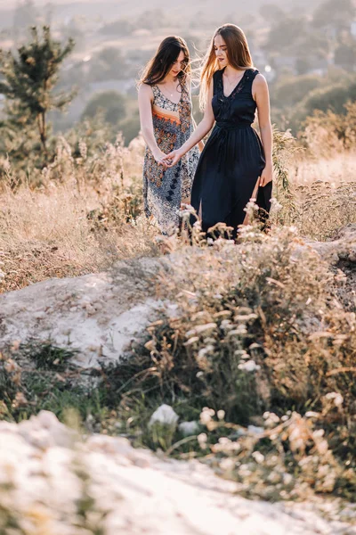Beautiful girls walking in mountains — Stock Photo, Image