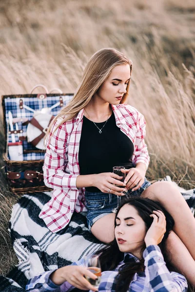 Beautiful girls on picnic in mountains — Stock Photo, Image